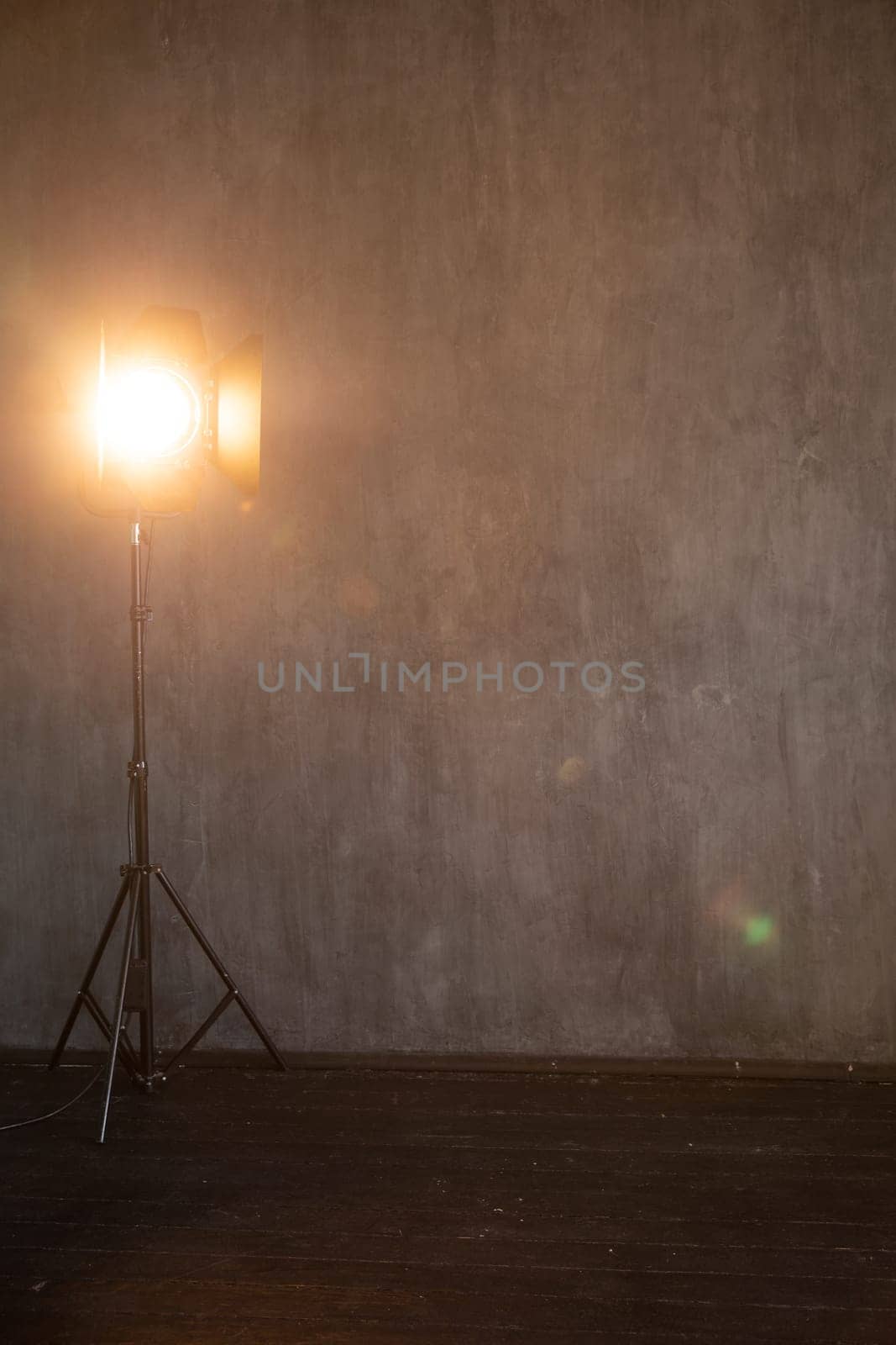 flash near dark background in a photo studio