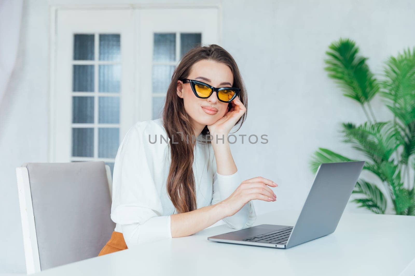 a communication brunette at the computer remote work internet conversation online communication