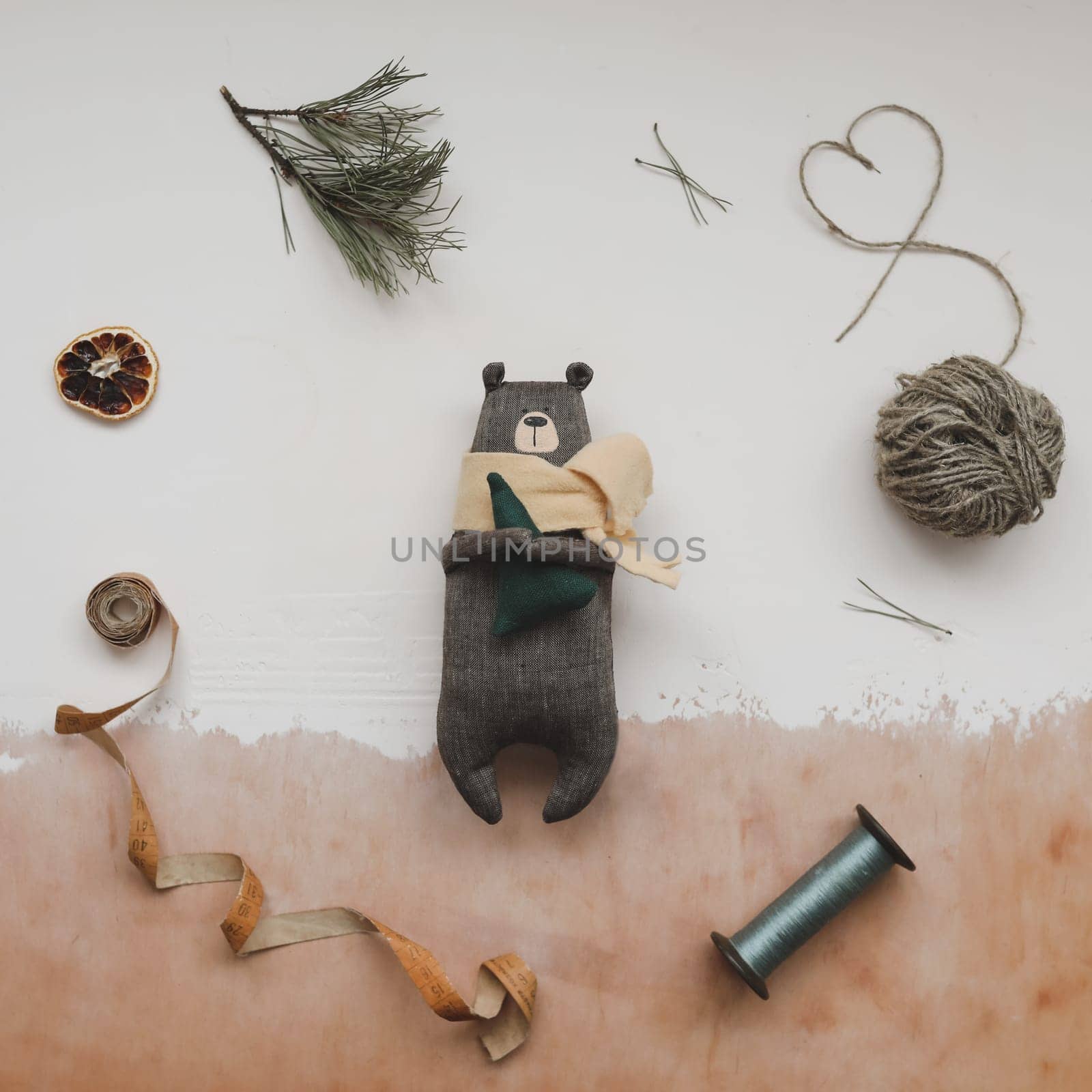 Christmas composition. Toy Teddy Bear, a gift, fir tree branches and decorations. Christmas, winter, new year concept. Flat lay, top view, copy space.