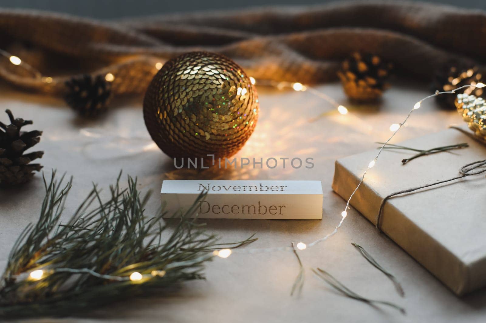 Christmas composition. New Year eve. December 31 on calendar on a craft paper background with spruce branches and a glowing garland. New year's date. Flat lay, top view by paralisart