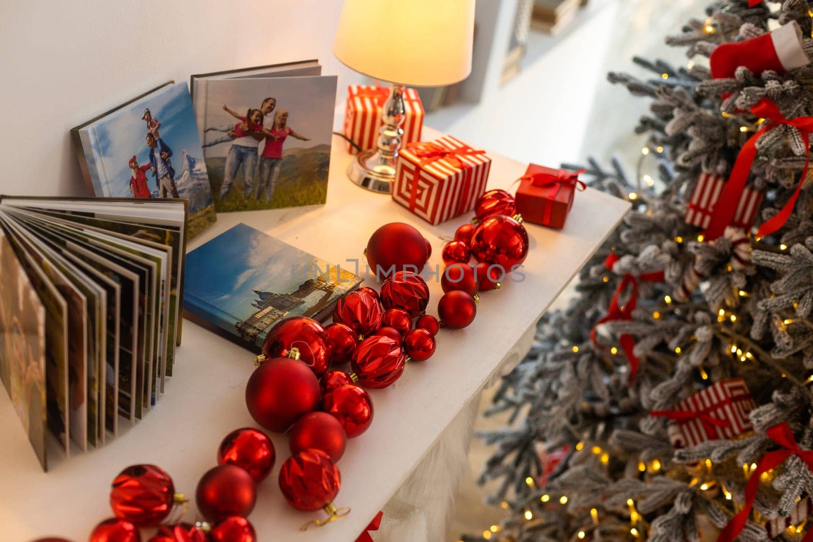 a photo album near the Christmas tree as a gift.