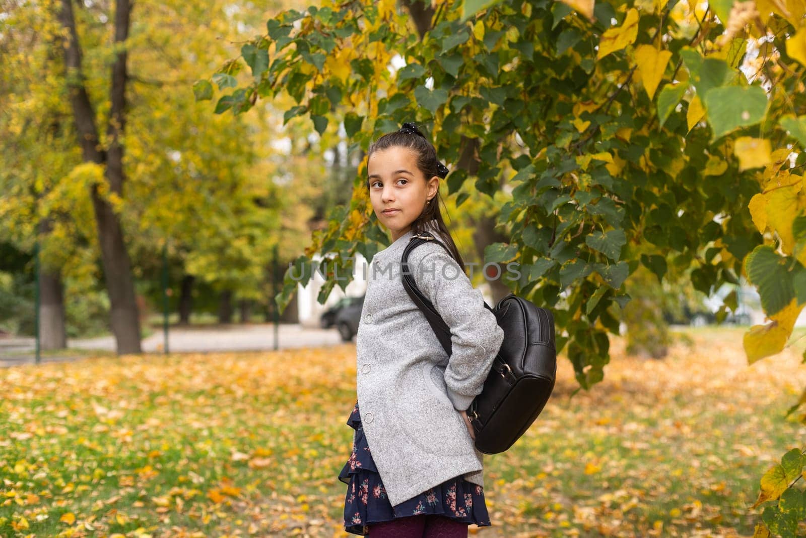 Cute girl with backpack going to school.