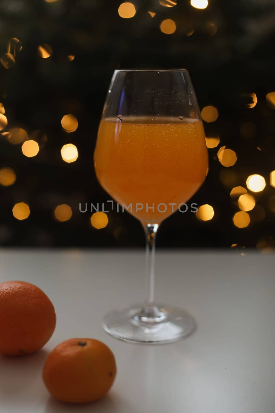 tangerine juice with tangerines on the background of the Christmas. High quality photo