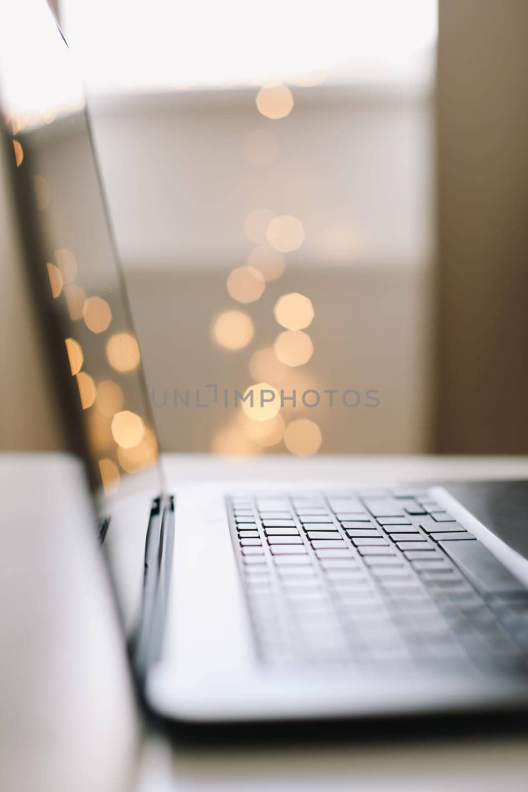 Freelance, working at home office, keyboard close up. Close up of laptop keyboard with blank screen