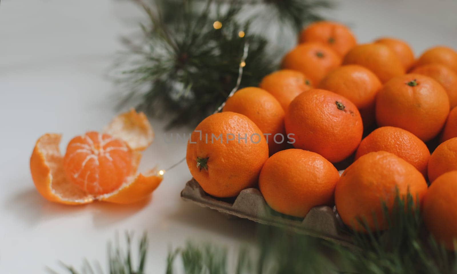 Christmas background with fir tree branches and tangerines. Merry Christmas and Happy New Year Greeting Card by paralisart