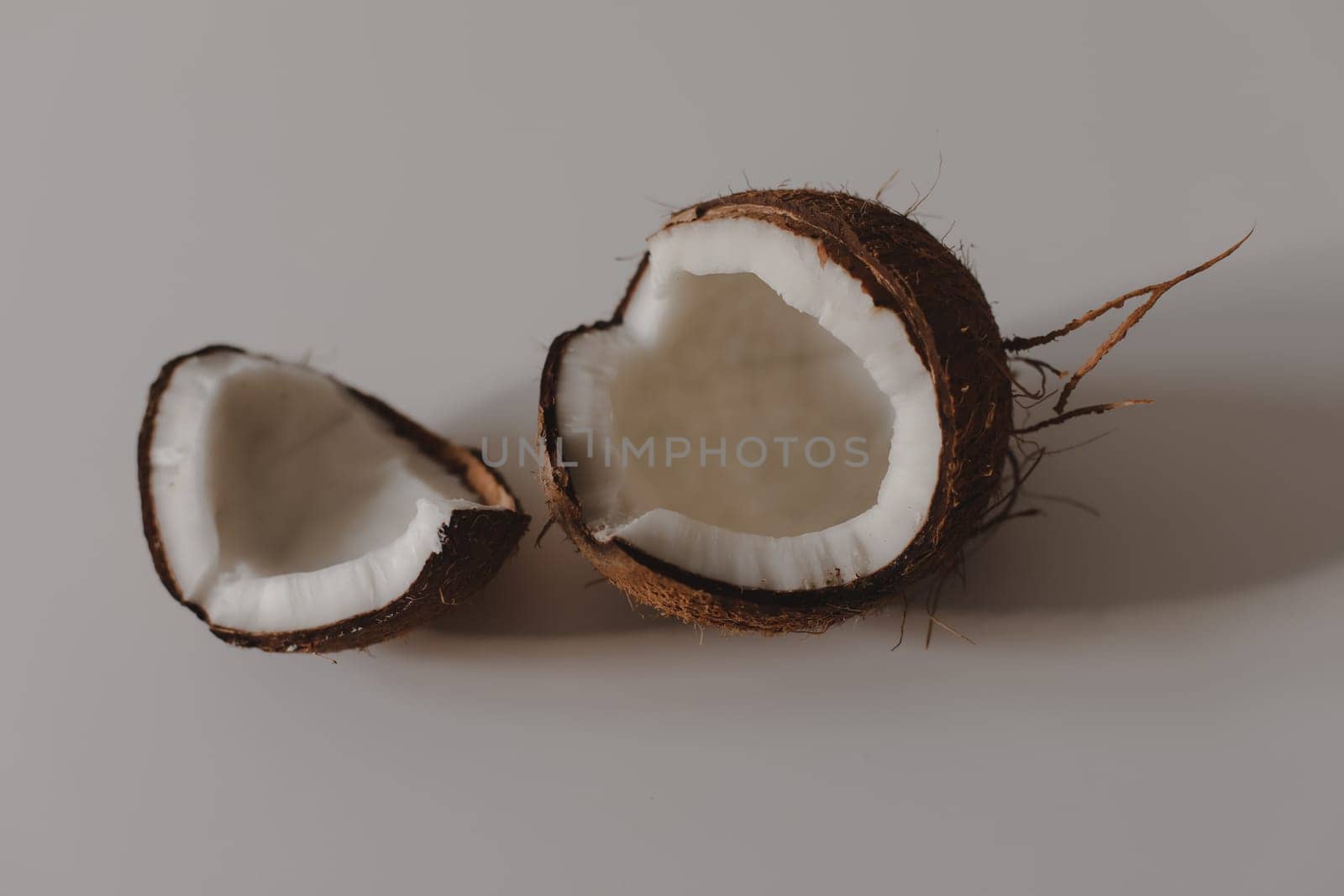 opened coconut slice and pieces isolated on white background.