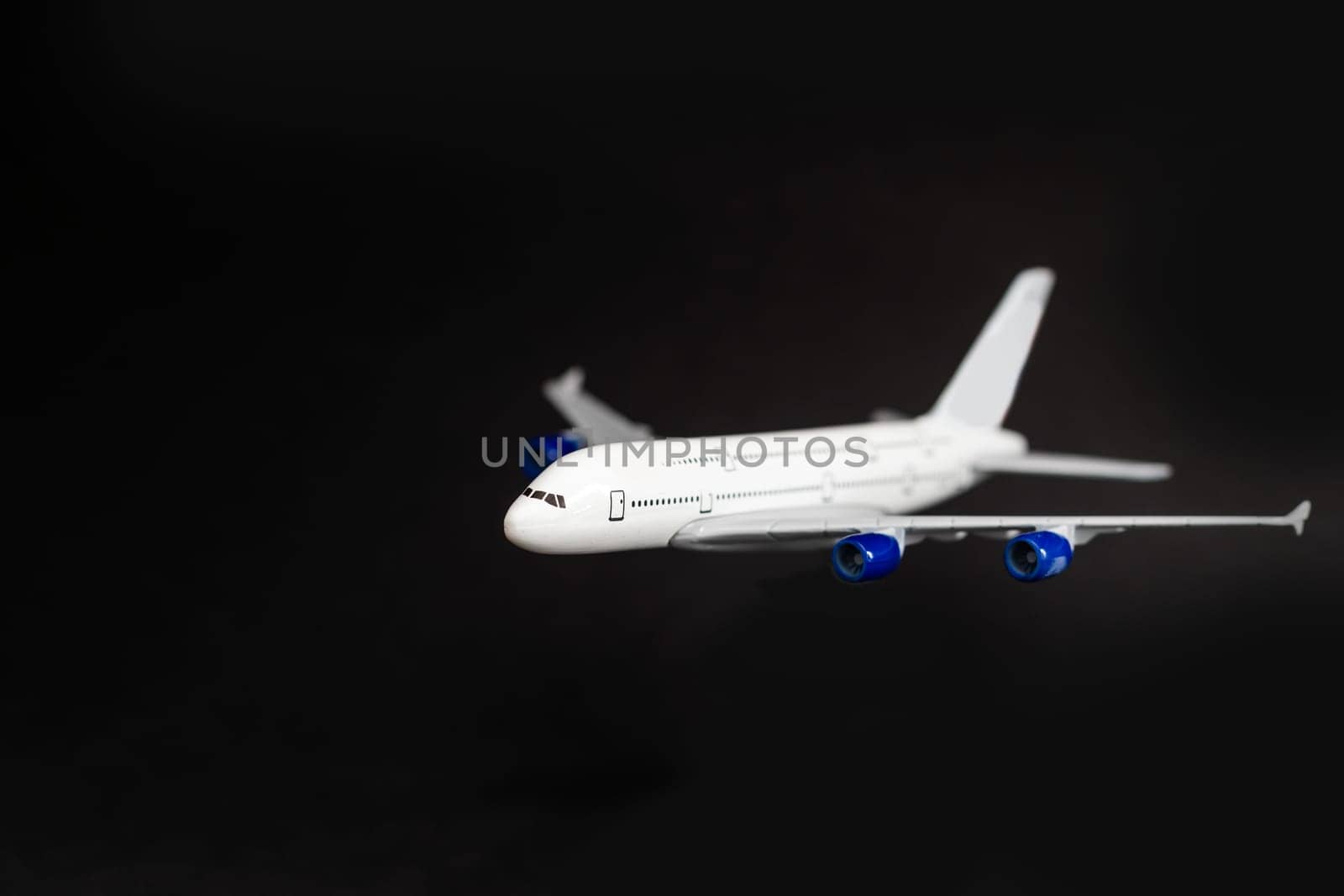 Airplane isolated on dark background.