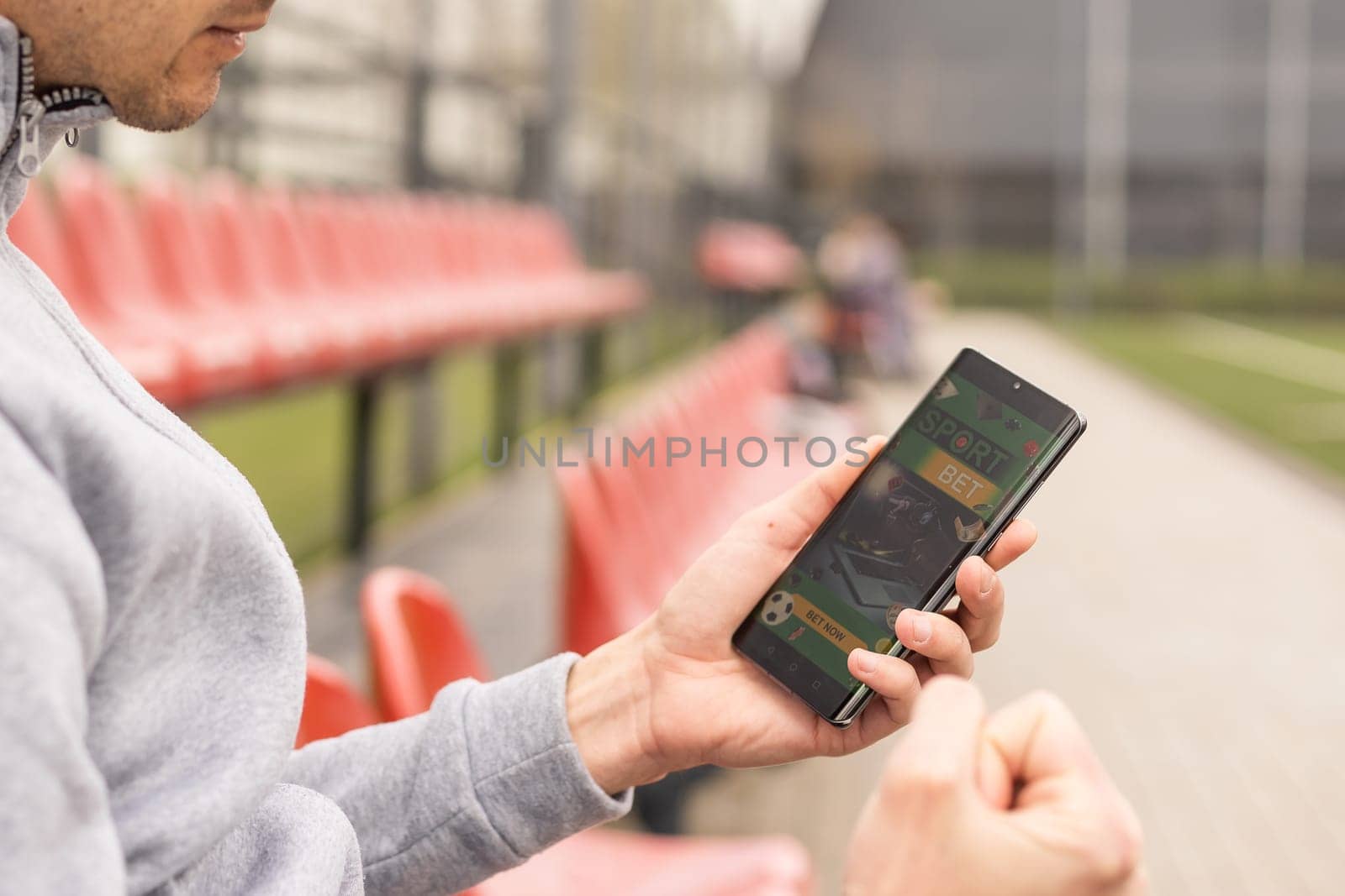 betting bet sport phone gamble over shoulder soccer live website concept. by Andelov13