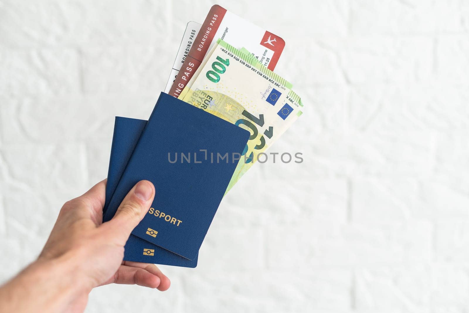 passport and money with businessman hand.