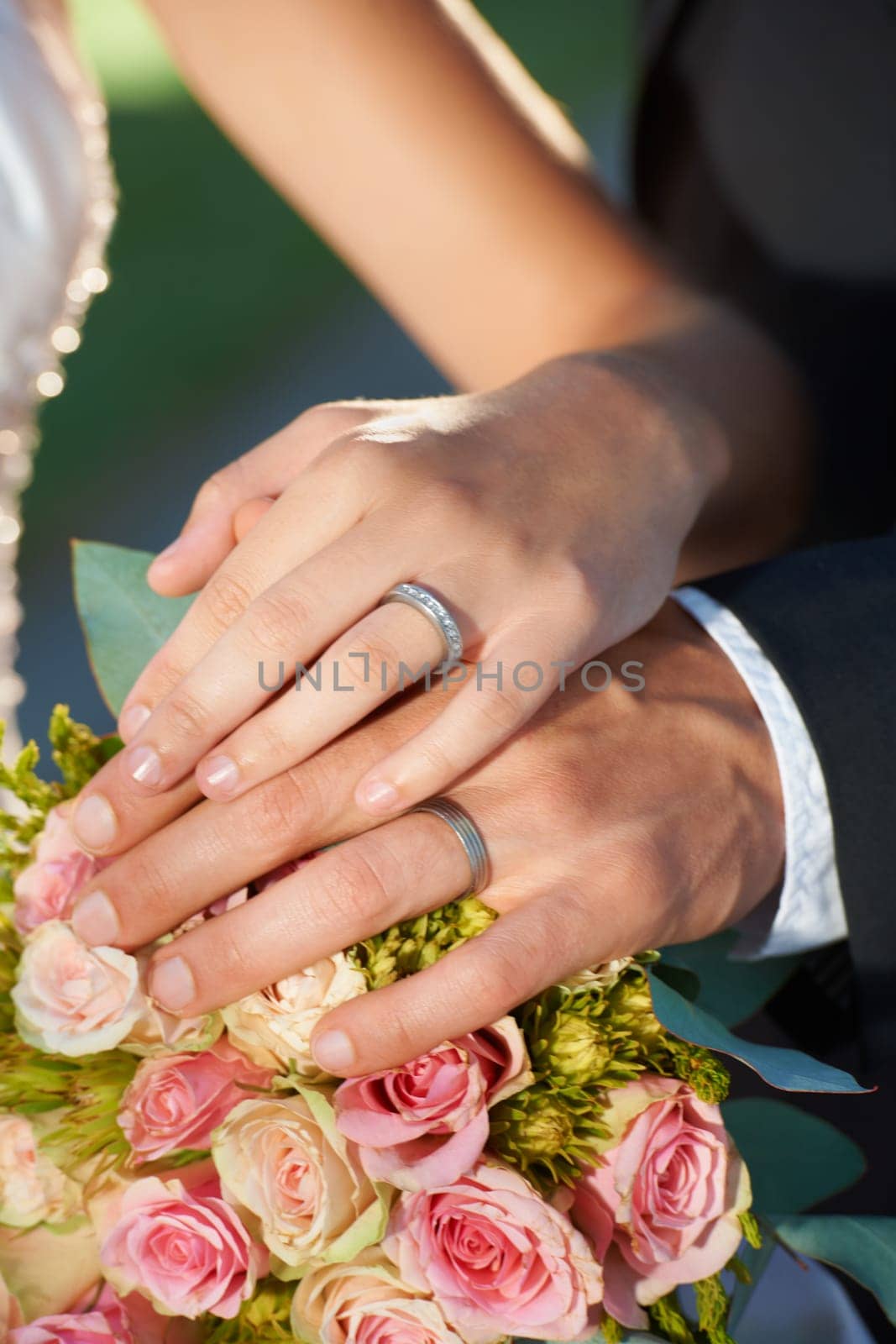 Couple, wedding ring and hand in marriage with bride and ceremony at celebration and trust event. Flower, loyalty and care with romance and holding hands with love and commitment with woman and man by YuriArcurs