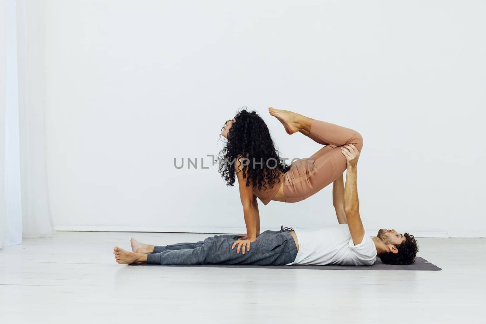 couple meditating together, sitting back to back