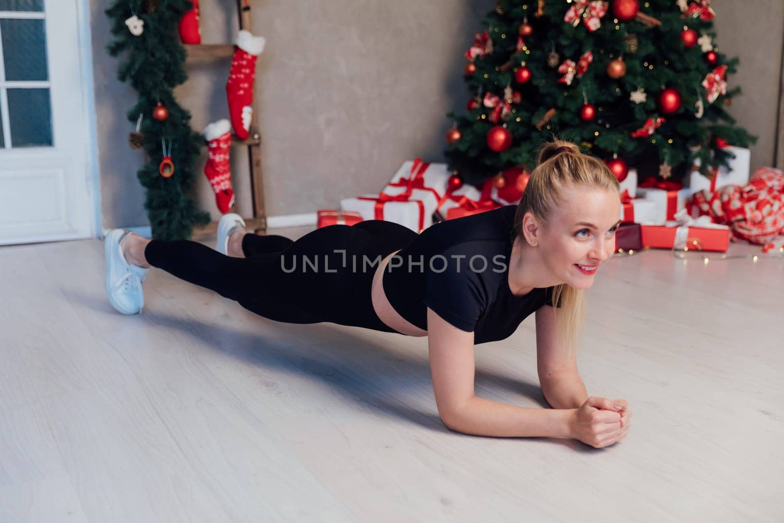 Fitness Woman Blonde Doing Gymnastics Strength Sport Christmas Tree New Year