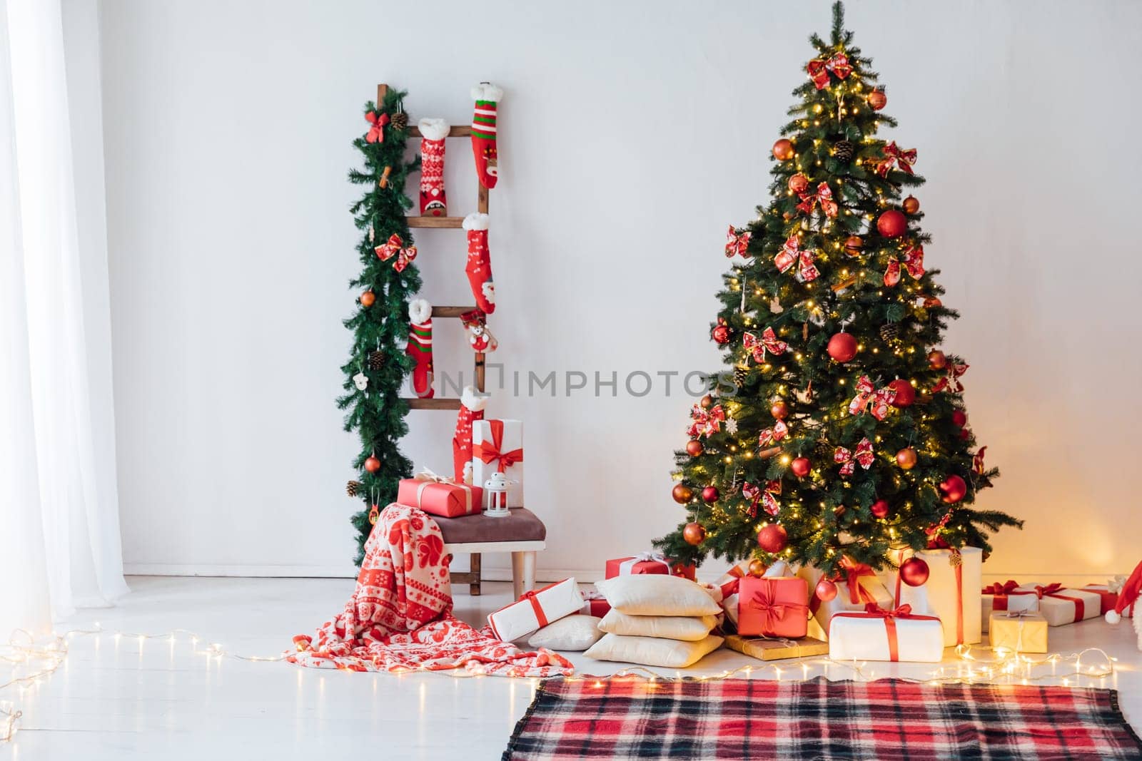 christmas tree with gifts and toys in interior