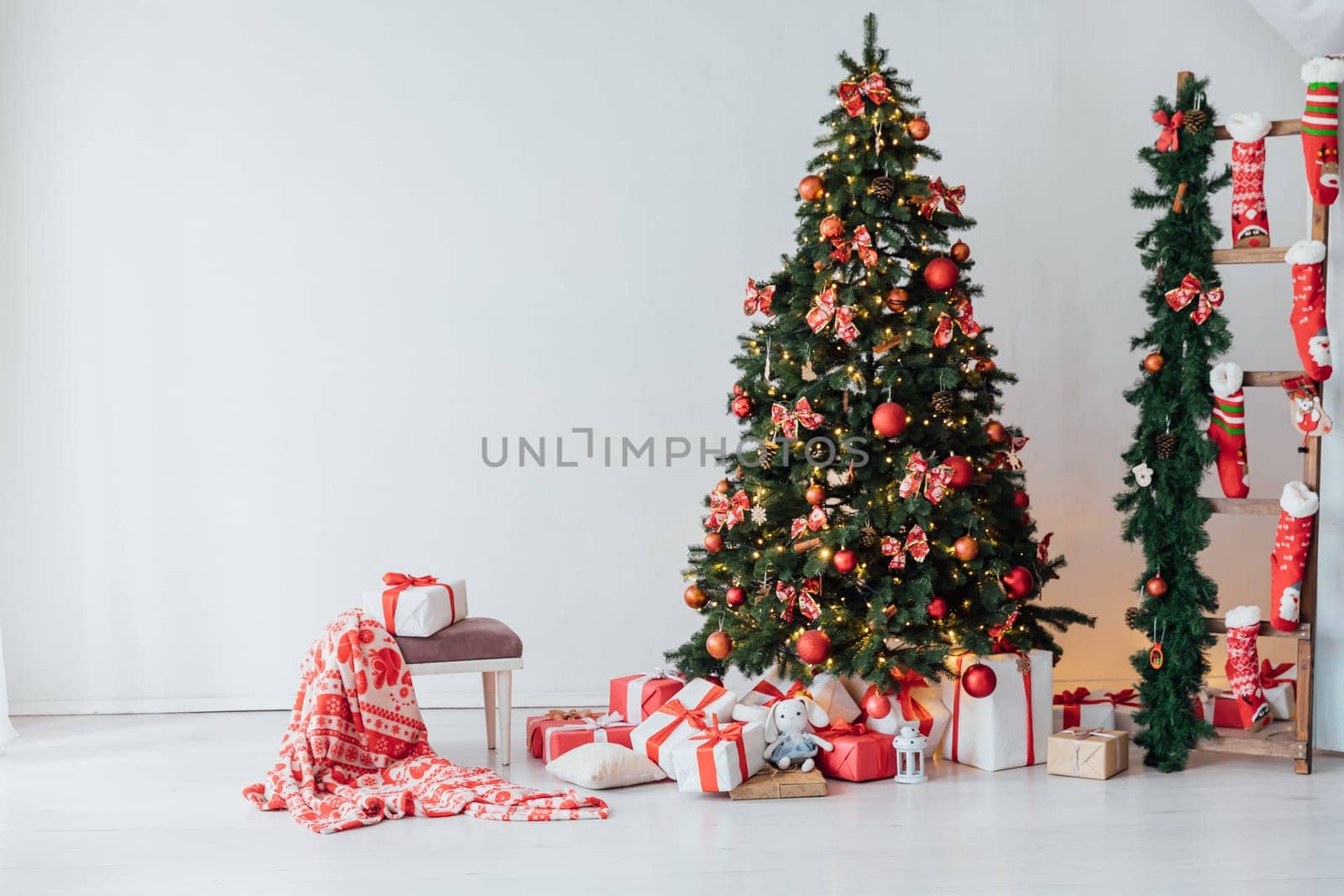 christmas tree with gifts and toys in interior