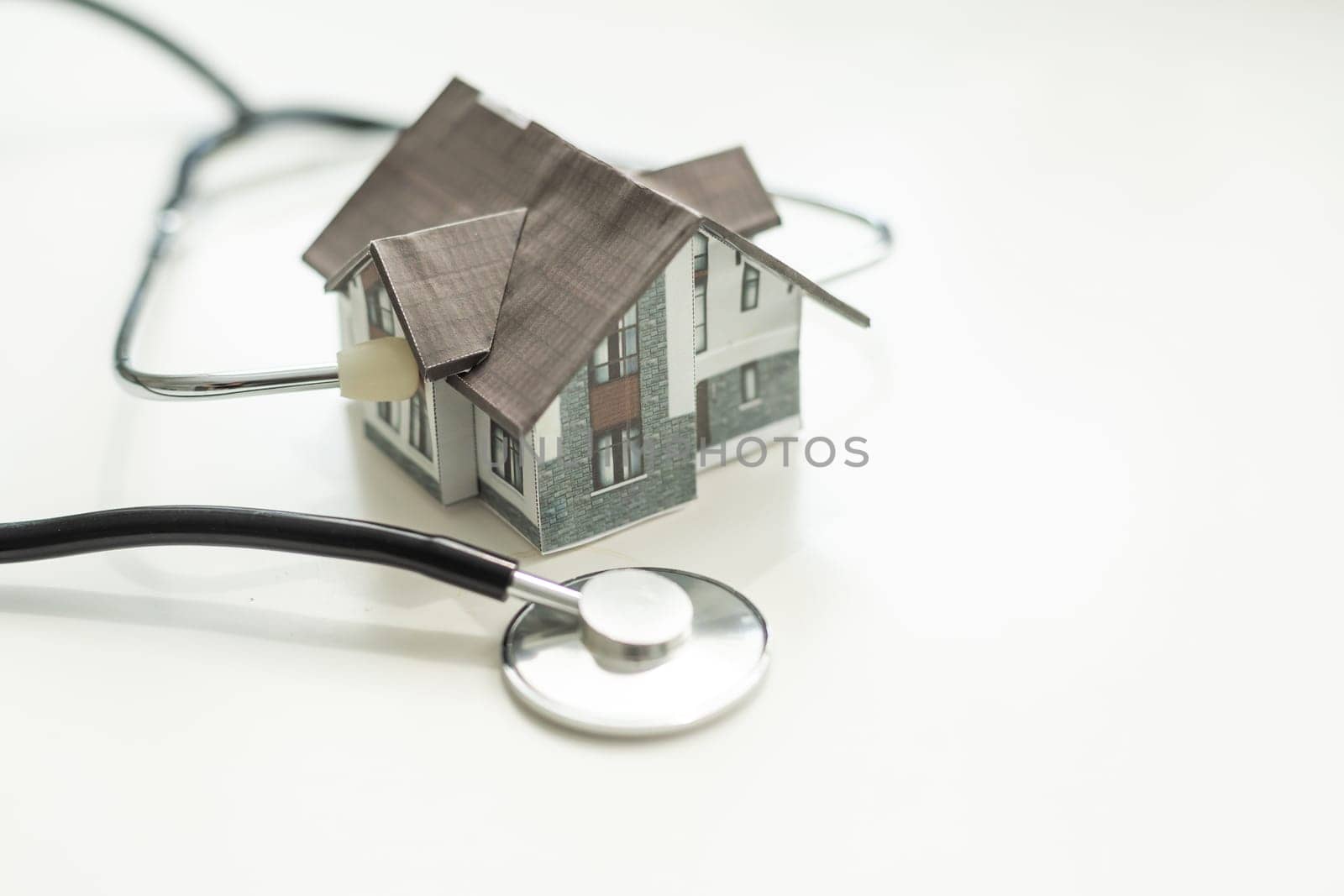 House and Stethoscope isolated on white background. High quality photo