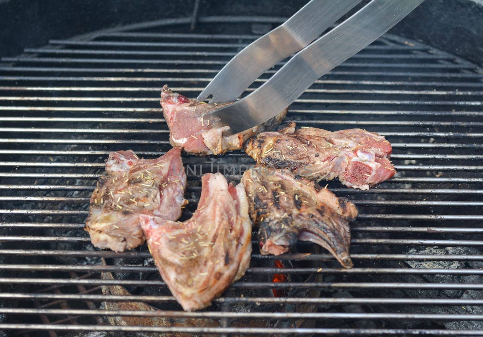 Ribs of lamb frying on grill barbecue