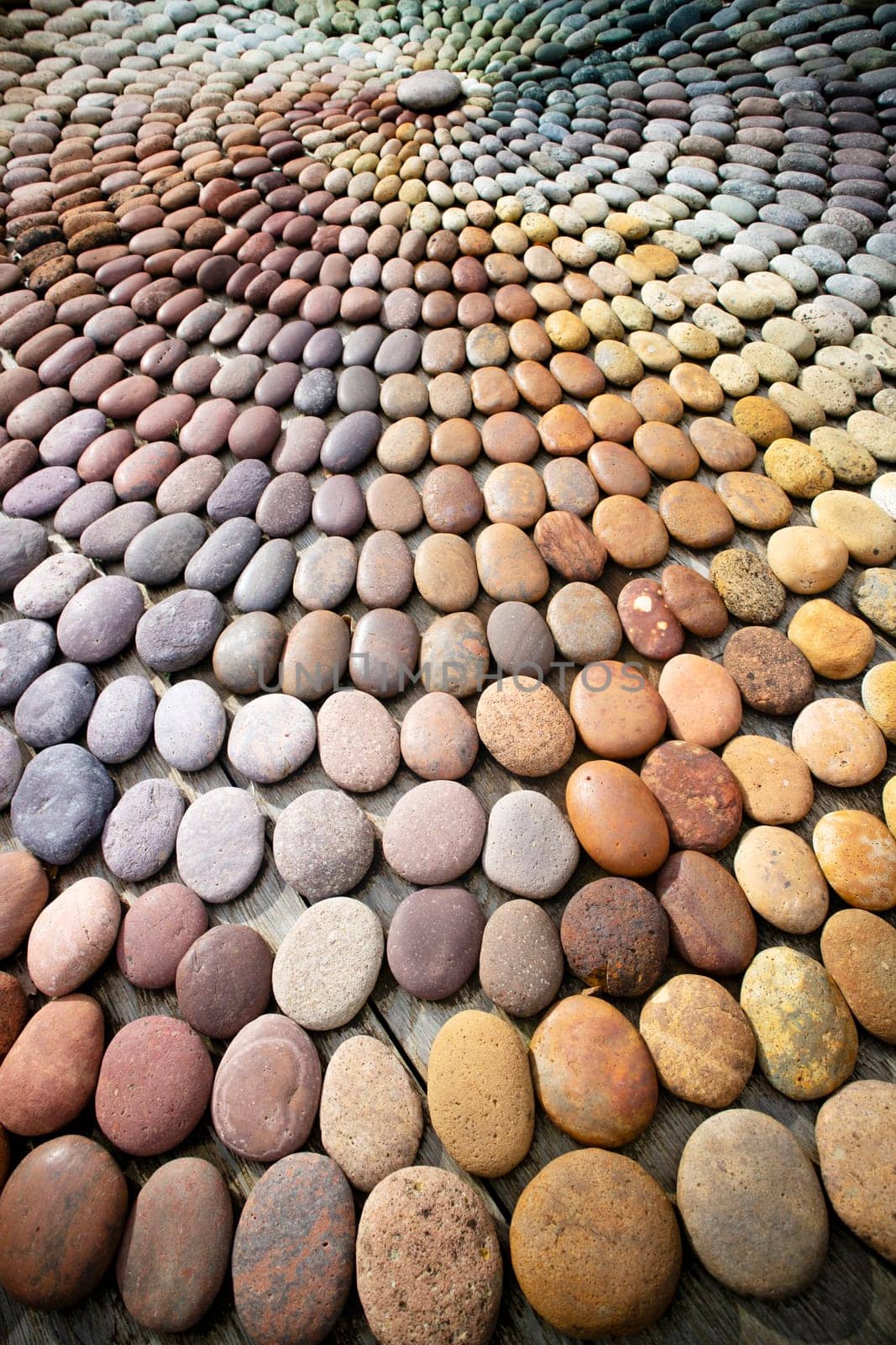 Photographic shot of the multicolor composition of a mosaic made of stones 