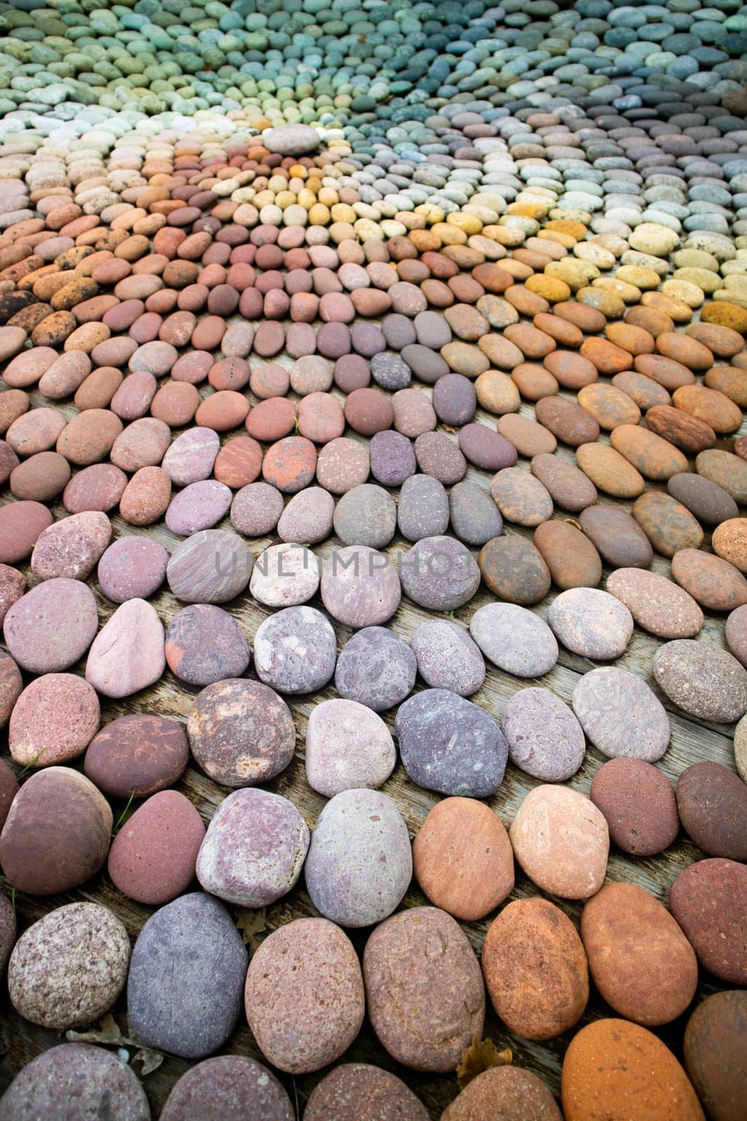 Photographic shot of the multicolor composition of a mosaic made of stones 