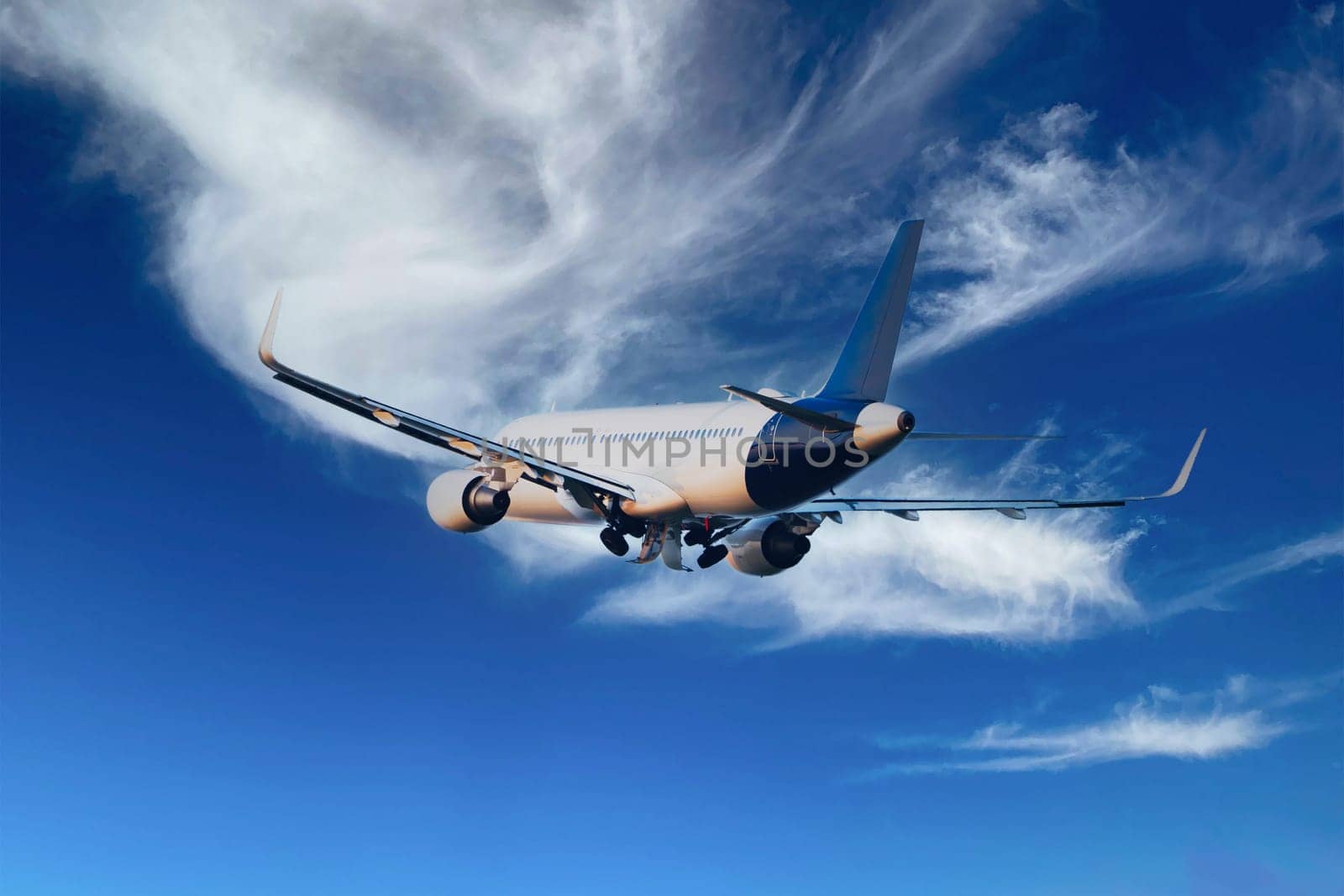 Passengers Commercial airplane flying above dramatic clouds. Concept of fast travel, holidays and business. Commercial transportation concept