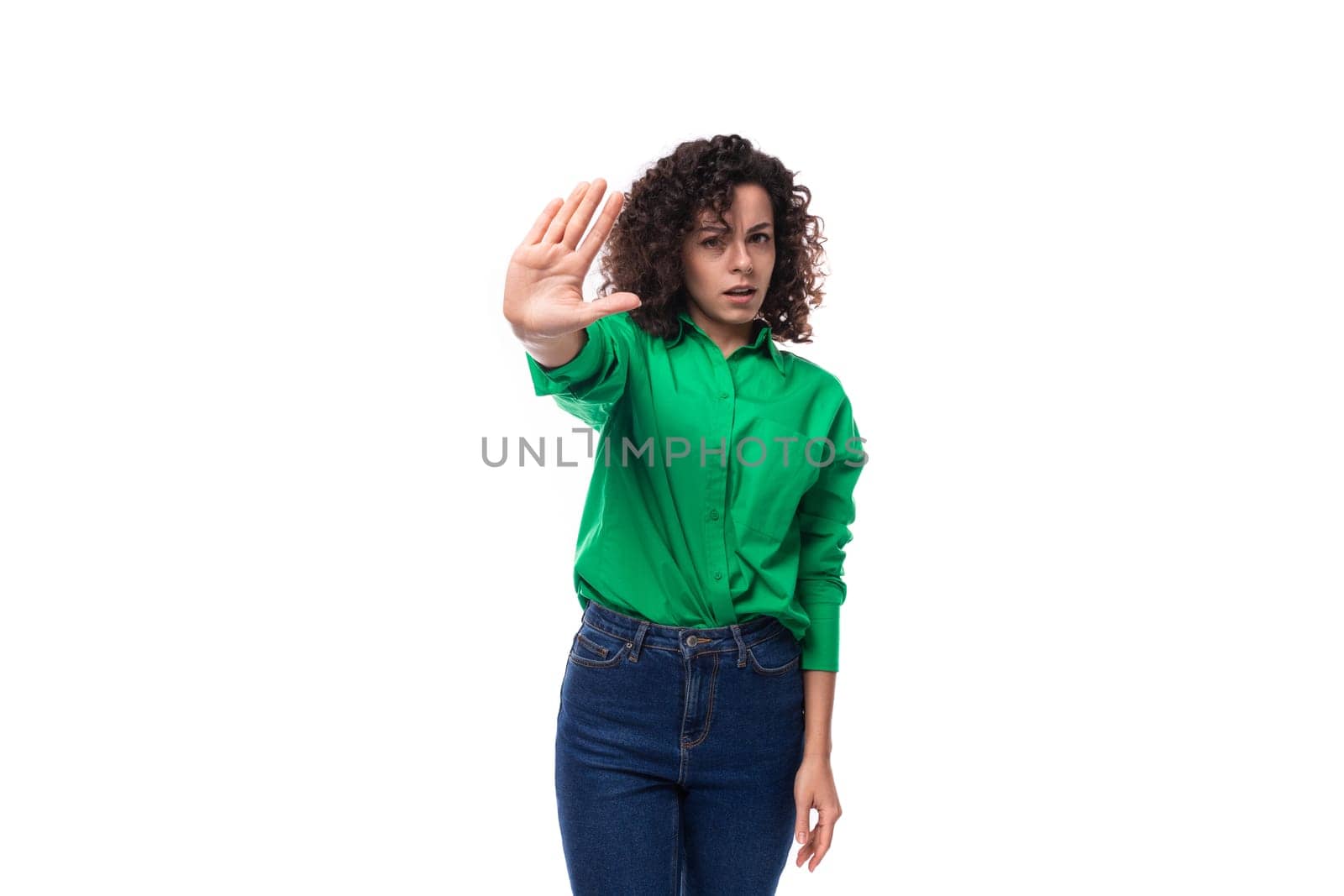 young confident brunette woman with stylish hair styling by curly method on white background with copy space by TRMK