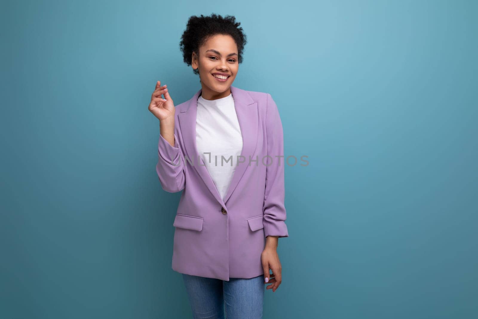 young pretty latin woman dressed in lilac jacket isolated studio background with copy space by TRMK