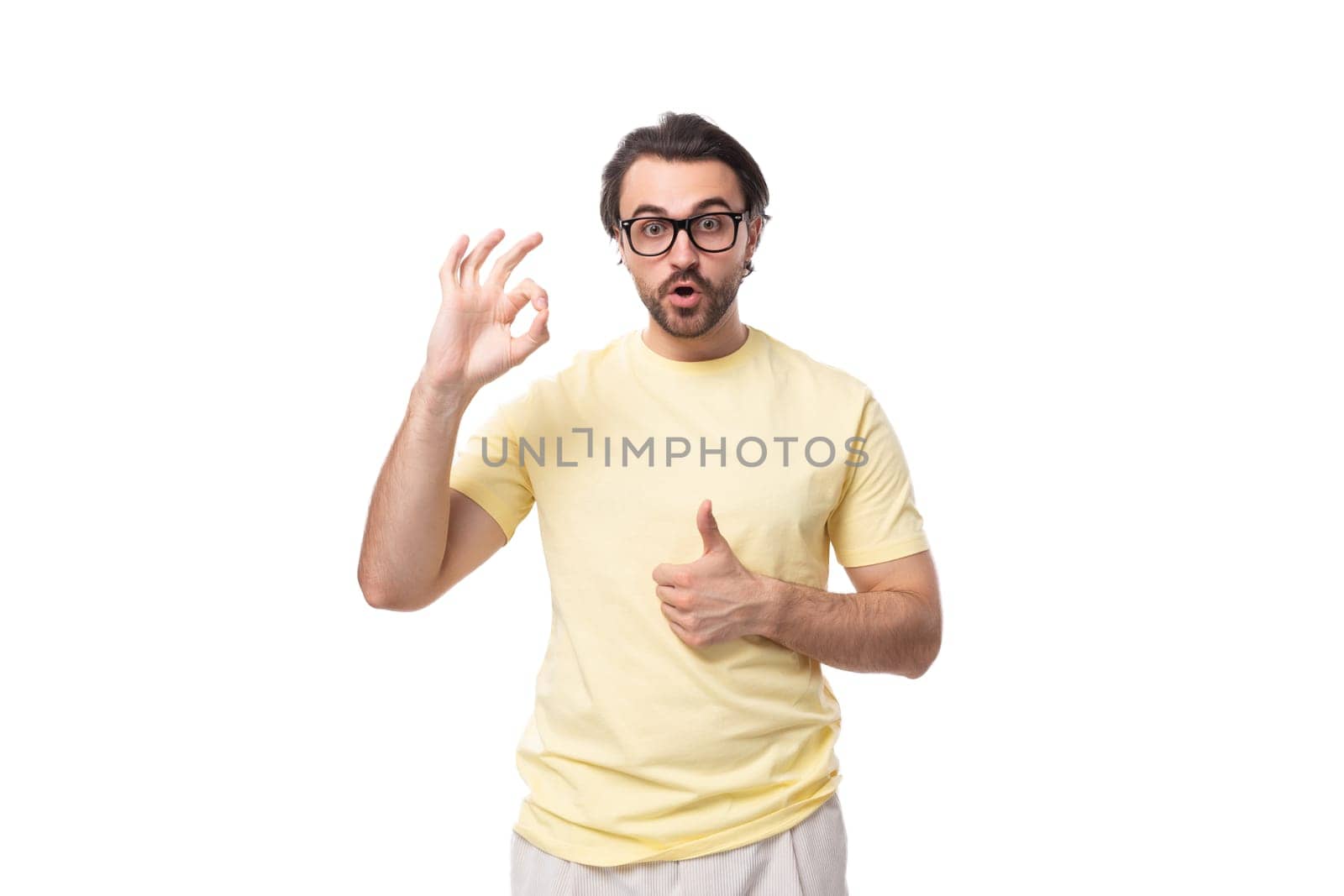 young caucasian man with black hair and beard looks at the camera in surprise by TRMK