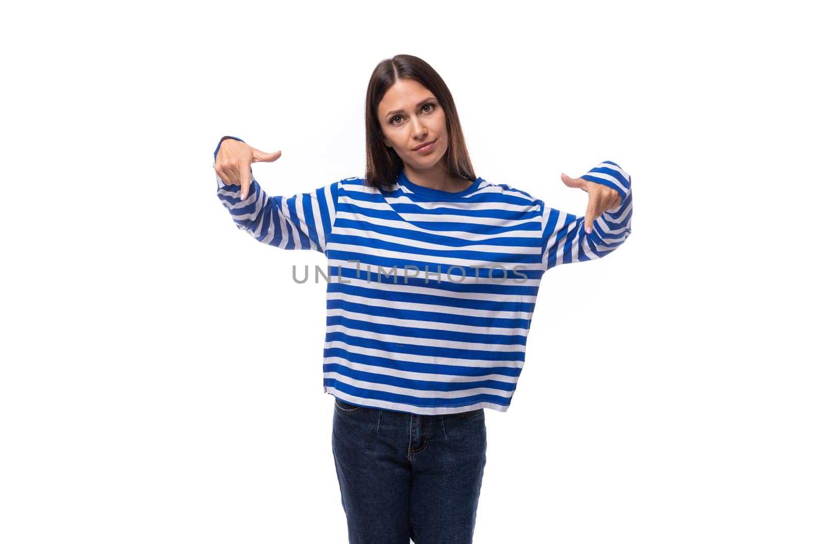 young stylish brunette lady in a striped blue turtleneck on a white background with copy space. people lifestyle concept.