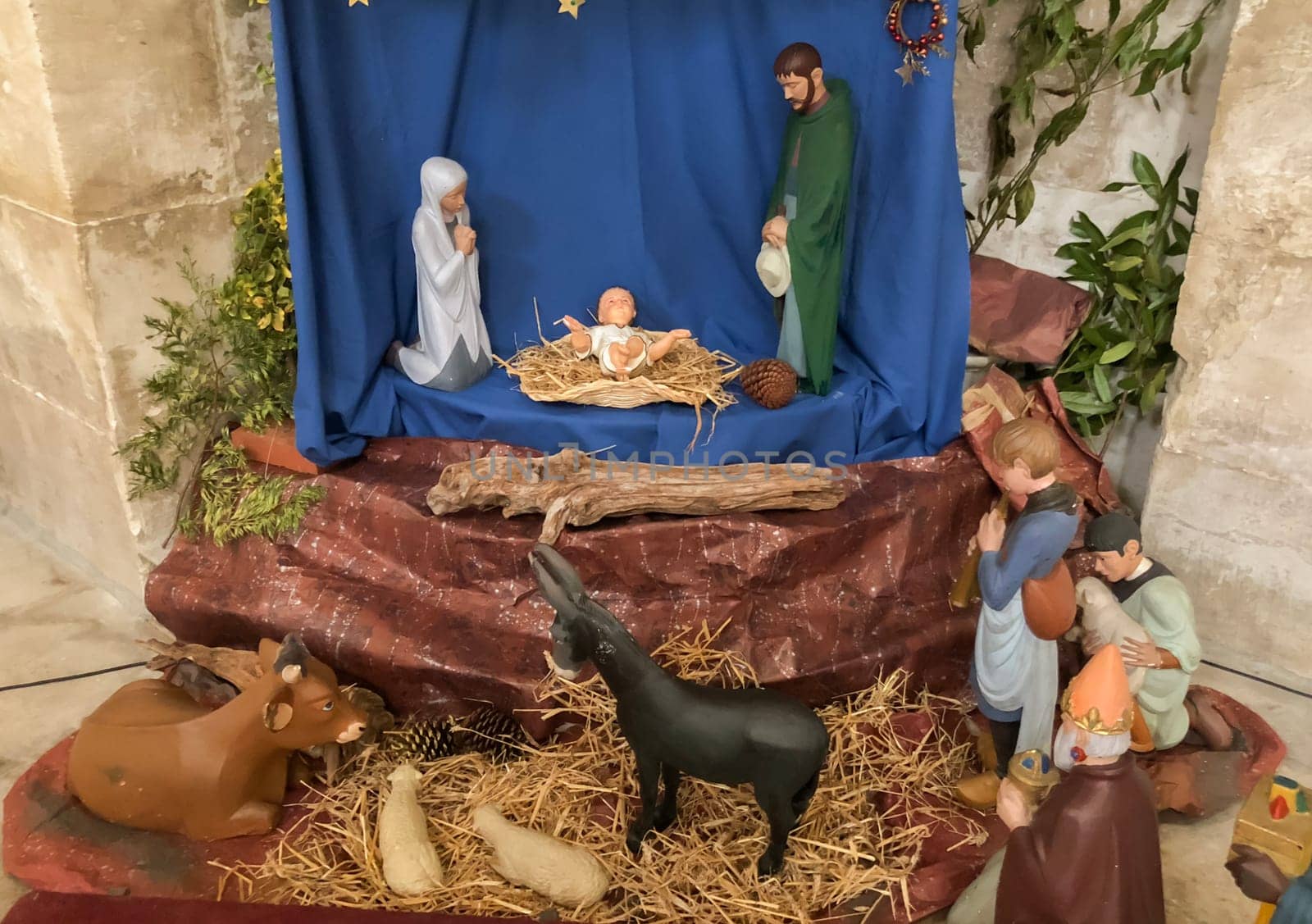 Scene of christmas creche with Joseph Mary and small Jesus