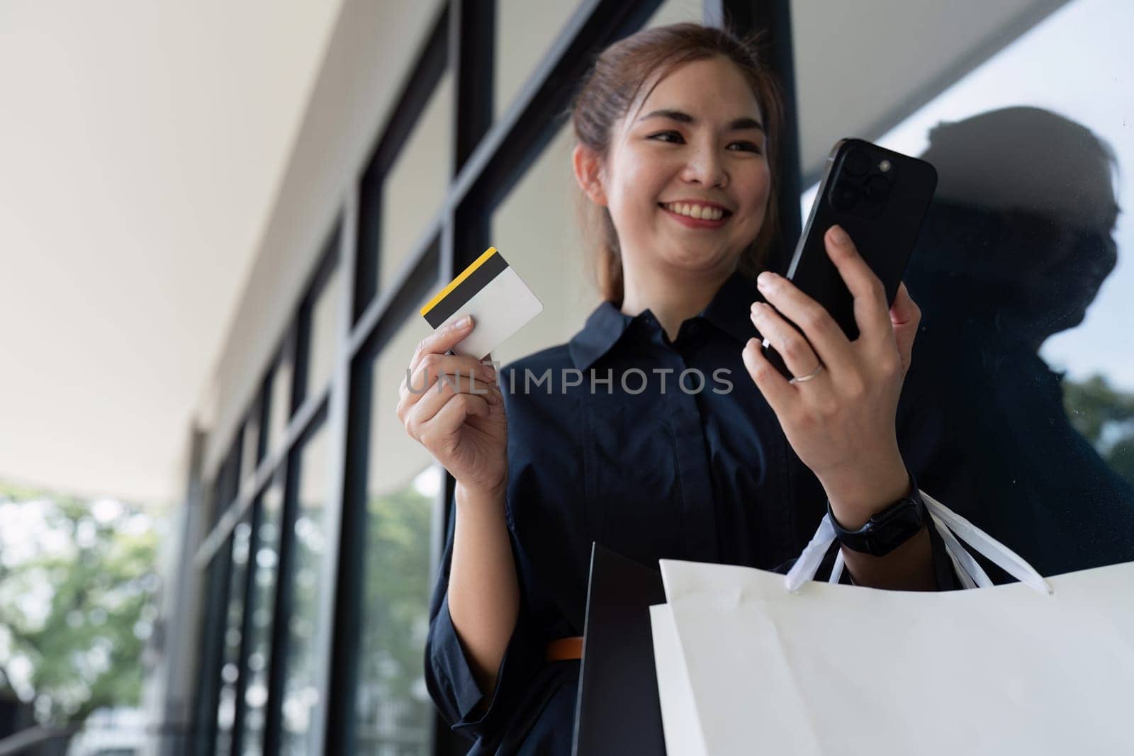 Shopping, credit card and phone for woman with ecommerce, information and confirmation. Online payment by itchaznong
