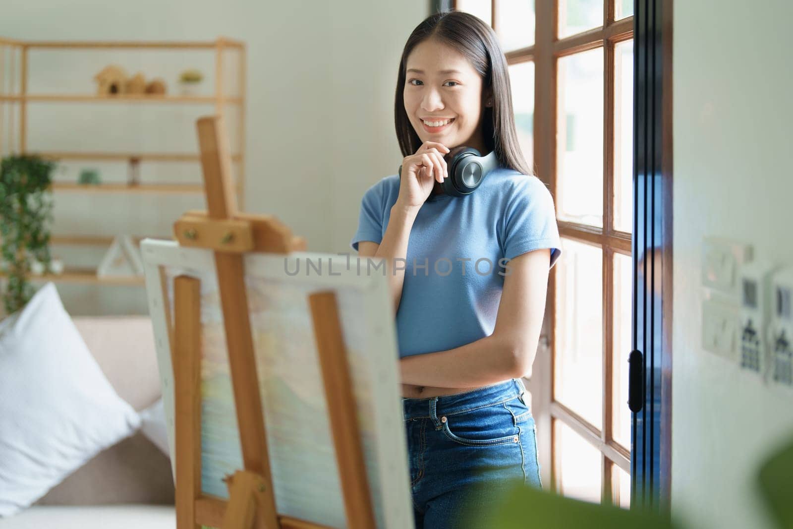 Portrait of an Asian woman designing art in her spare time. by Manastrong