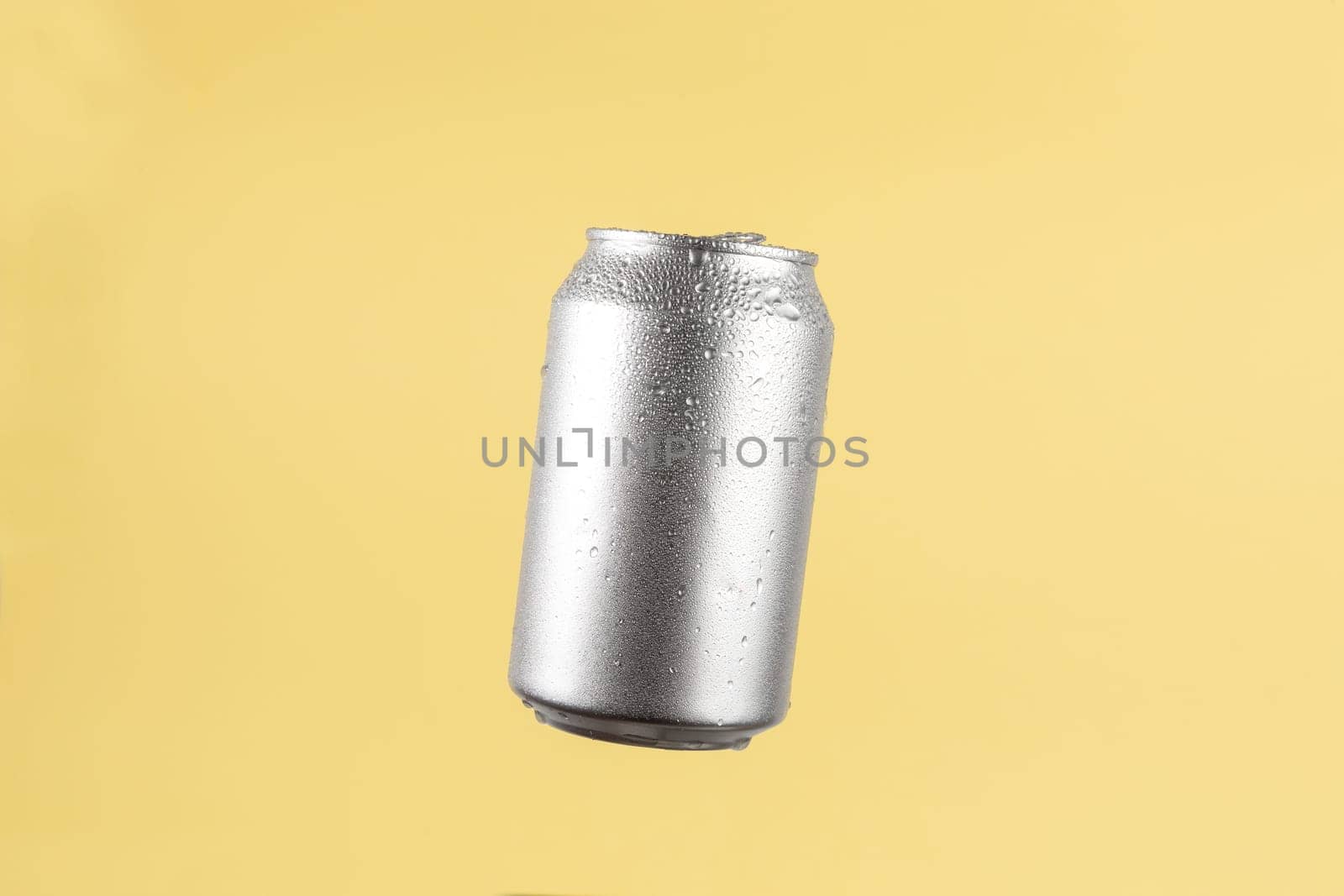 Aluminium beer or soda drinking can on light yellow background by TropicalNinjaStudio