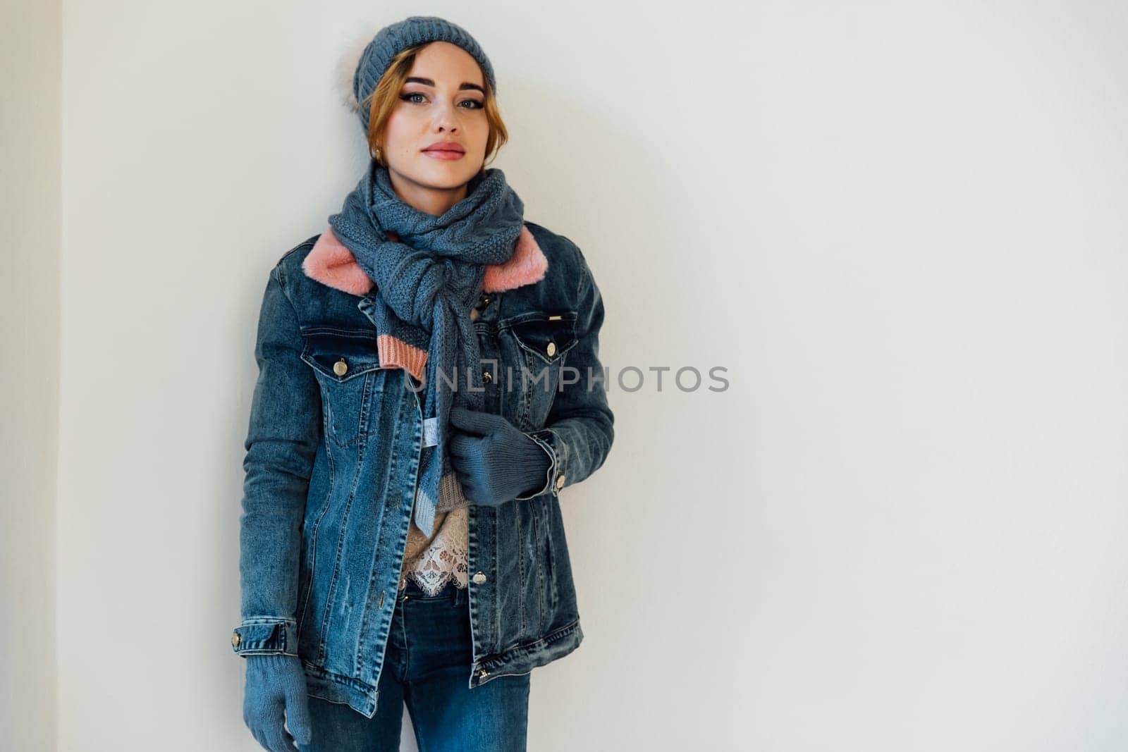 Beautiful woman in winter clothes and knitted hat by Simakov