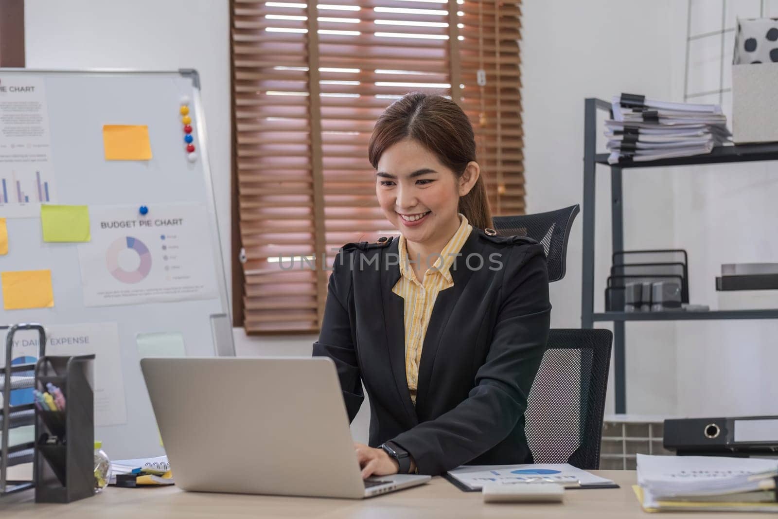 Business woman using calculator for do math finance on wooden desk in office and business working background, tax, accounting, statistics and analytic research concept..