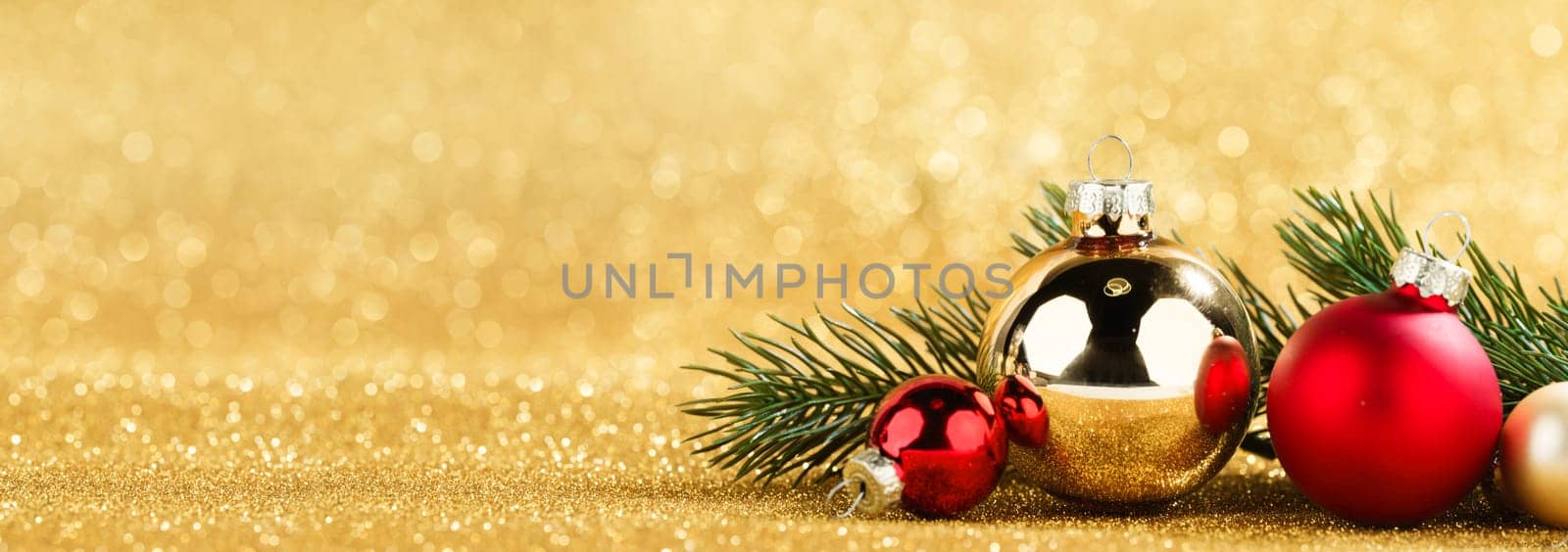 red and gold balls and fir on bokeh background by Yellowj