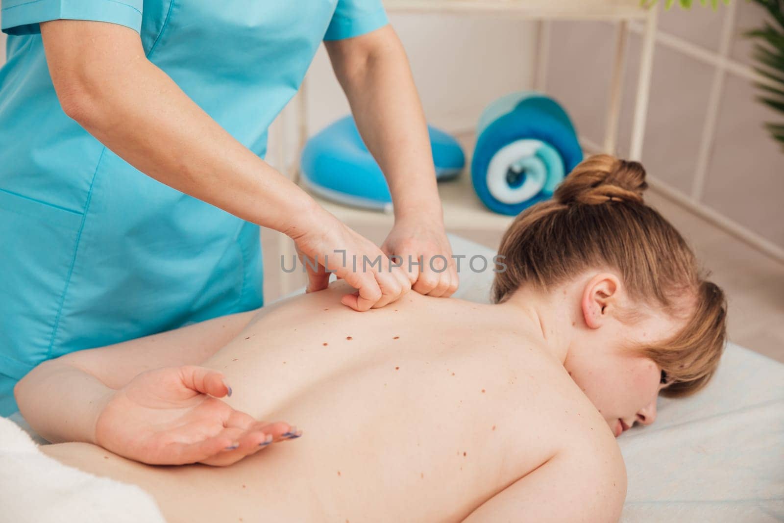 woman relaxing and having massage in a SPA.