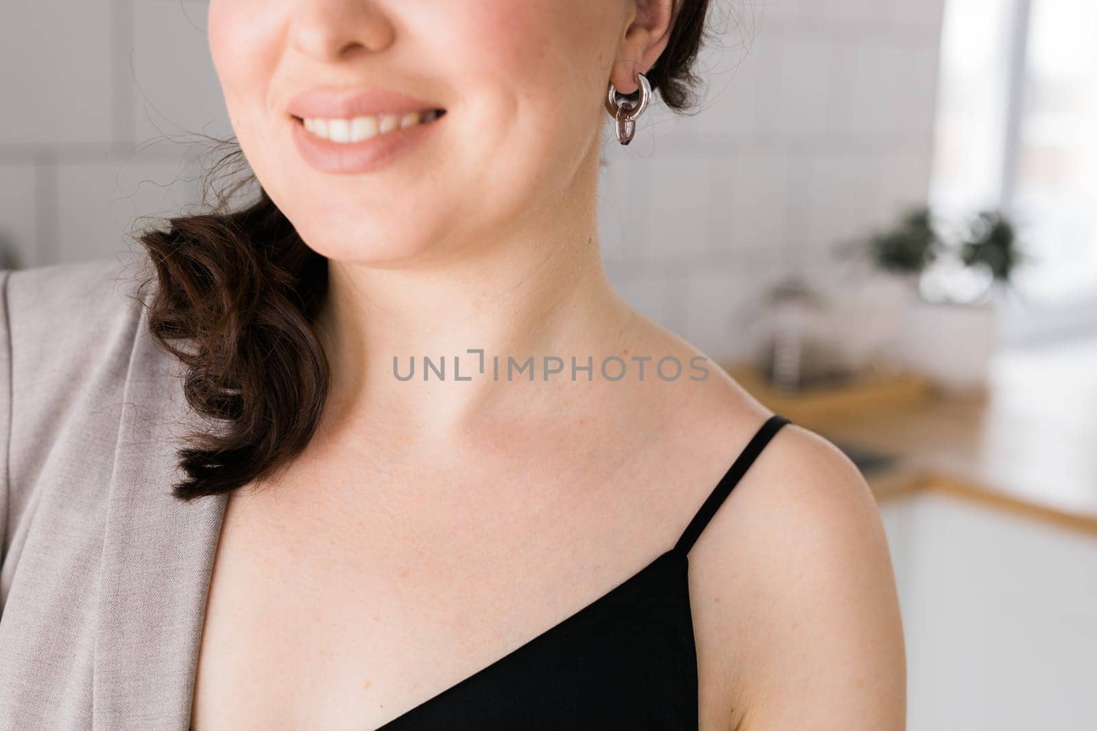 Close-up woman wearing beautiful luxury earrings. Handmade jewellery and accessories. by Satura86