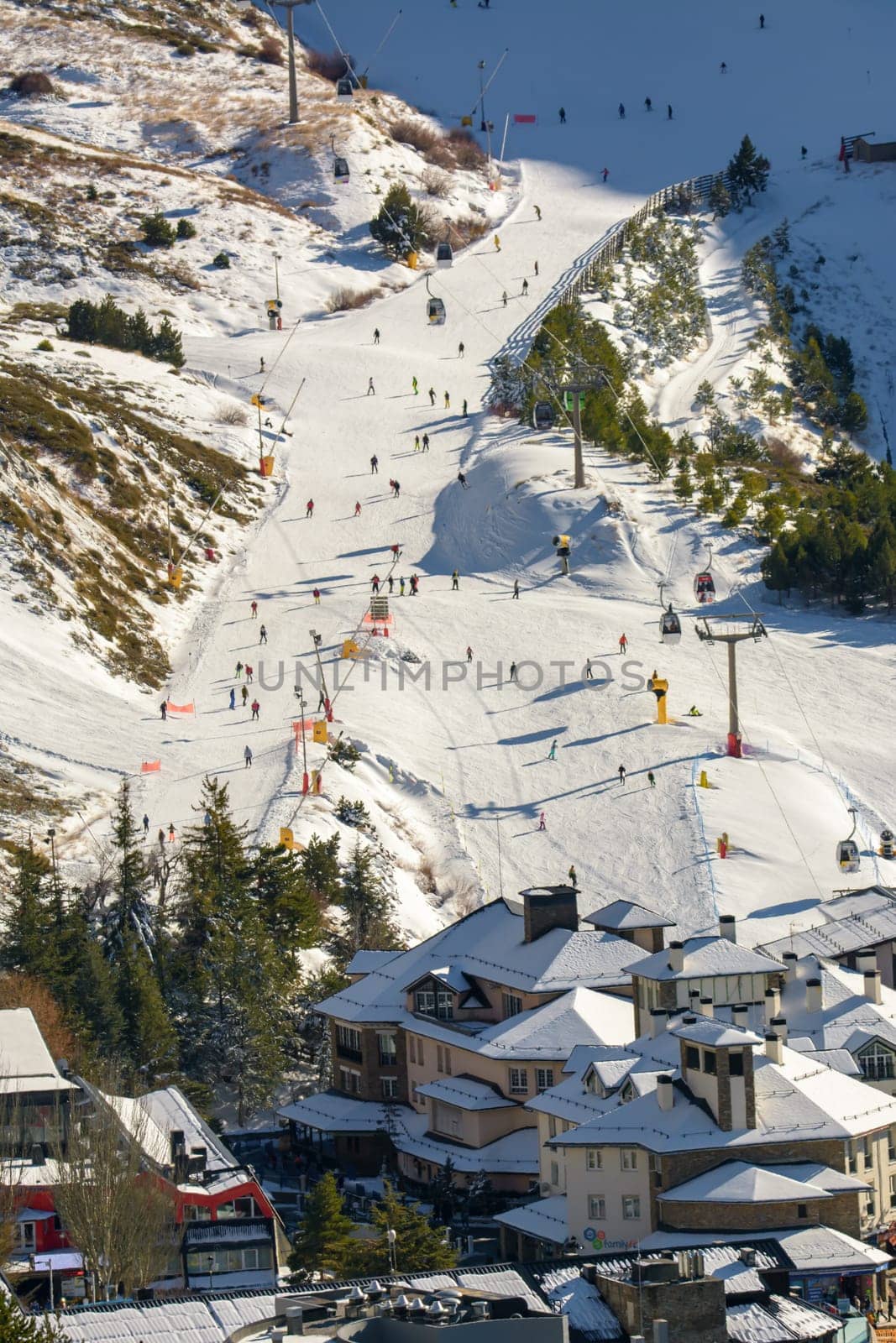 aerial view, ski lifts and slopes of ski resort with crowds of people skiing, sierra nevada,granada,spain, seasonal concept ,