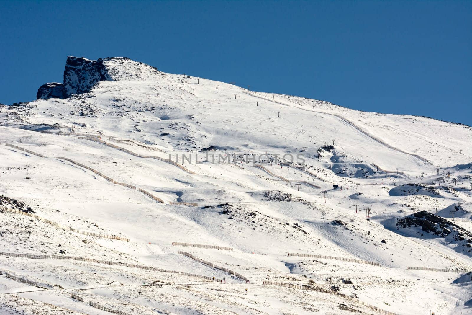 Sierra Nevada, Spain, a mountain range in Spain. It is a popular tourist destination, as its high peaks make skiing possible in one of Europe's most southerly ski resorts