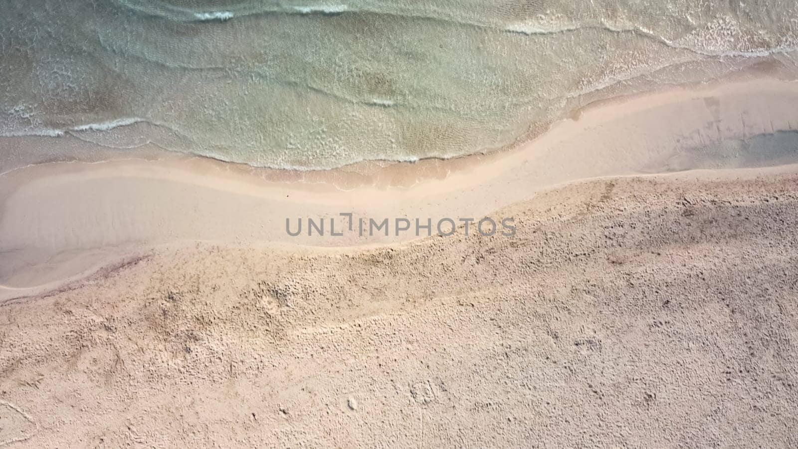 aerial view from drone of a natural paradise beach in the mediterranean, with crystal clear water and white sand. sa Coma Mallorca, Balearic Islands