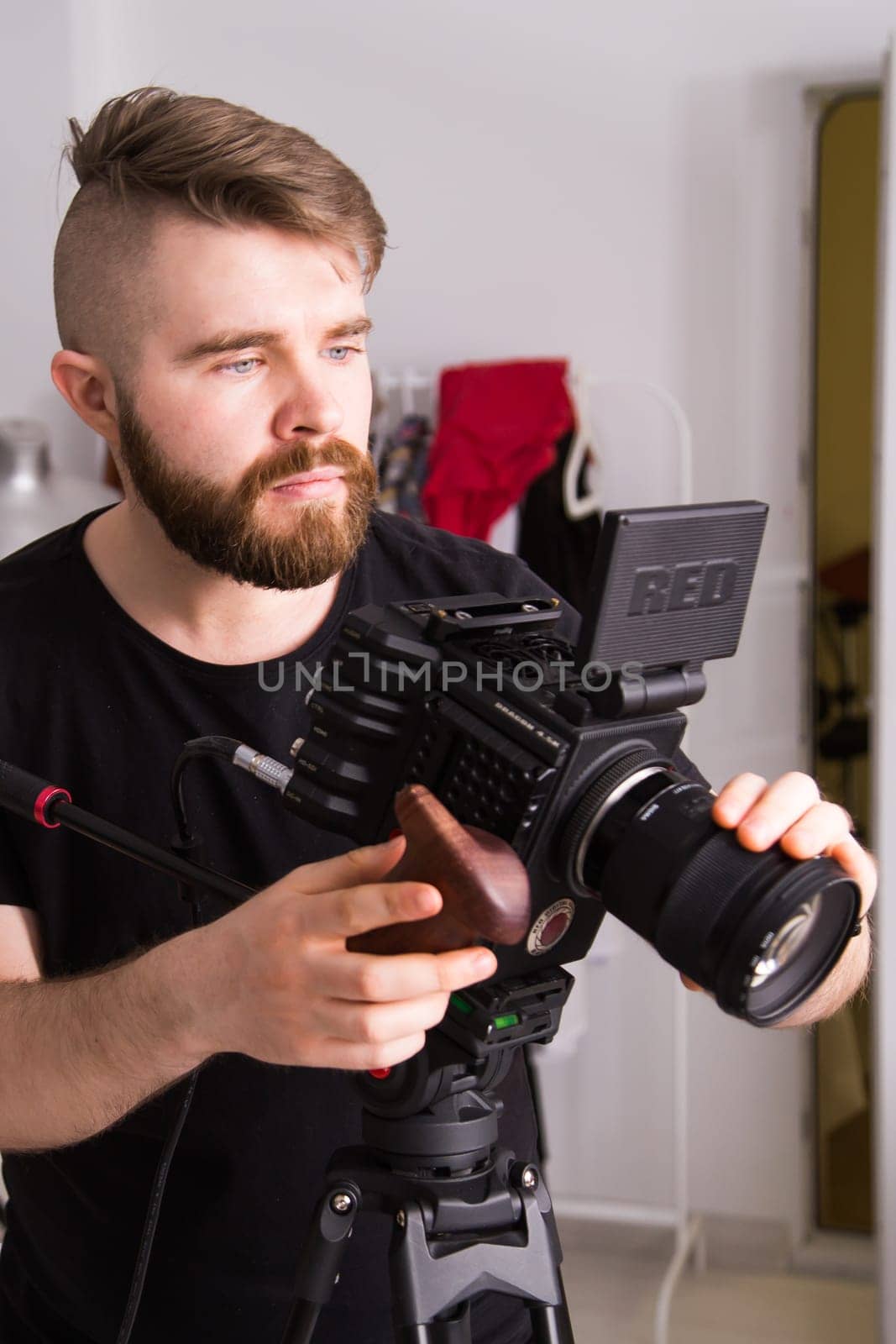 UFA, RUSSIA - 29 FEBRUARY 2020: cameraman works with Red digital cinema cameras. RED is the leading manufacturer of professional digital cinema cameras by Satura86