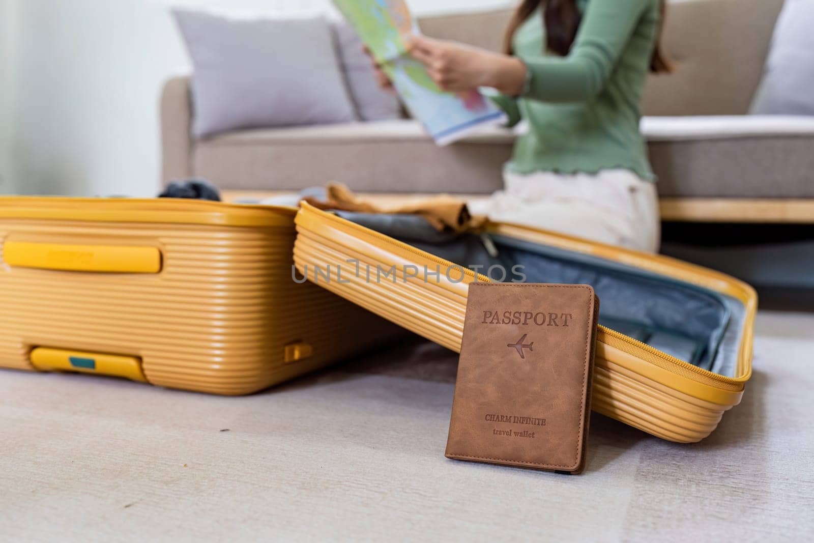 Woman packing a suitcase for a new travel trip. bag and luggage for journey.