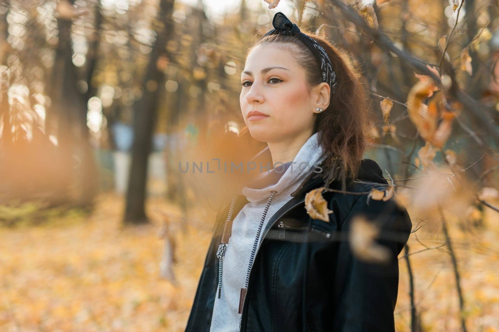 Outdoor atmospheric lifestyle portrait of young beautiful young woman copy space. Warm autumn fall season. Millennial generation and youth by Satura86