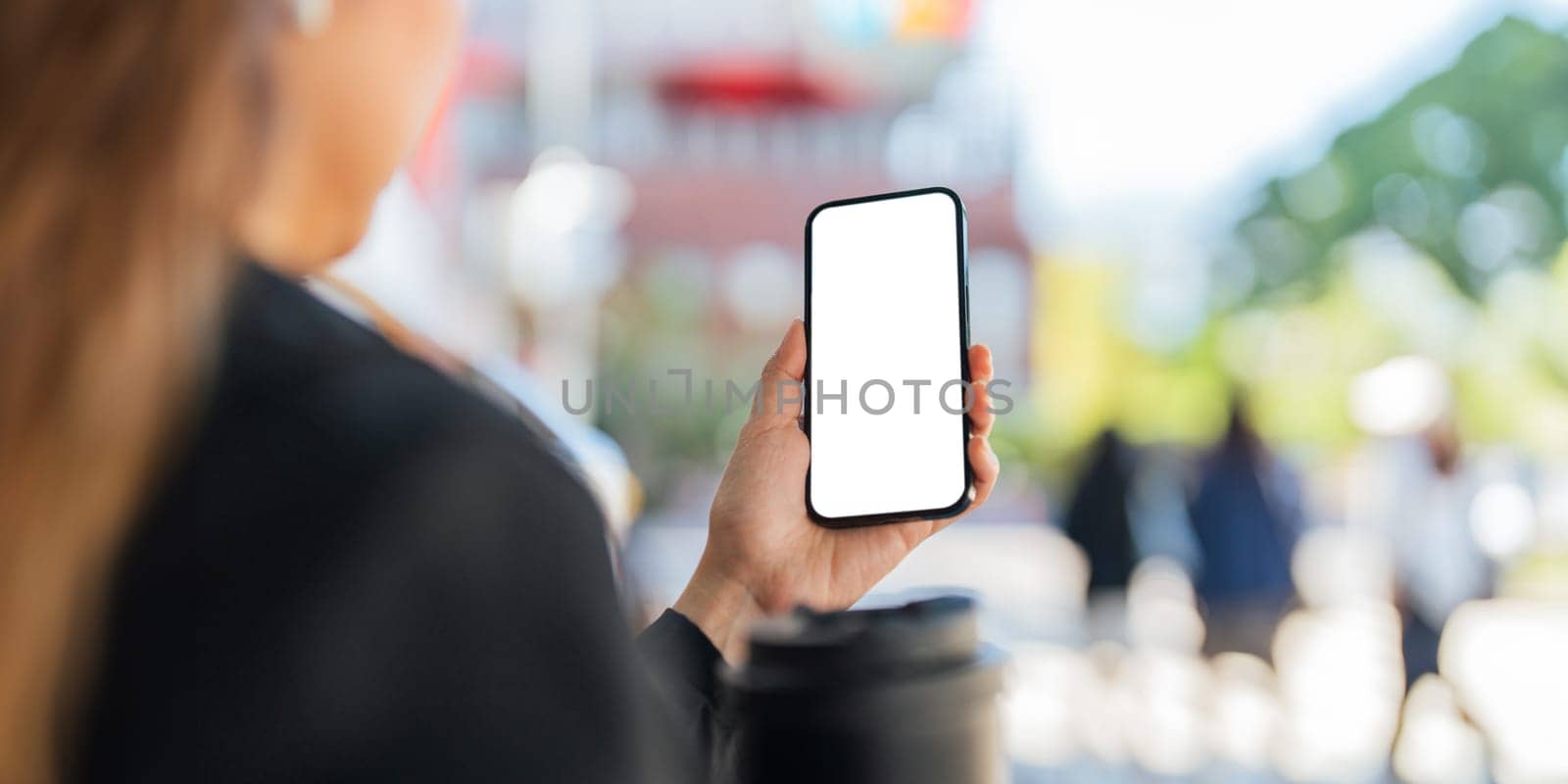 Business woman use mobile phone on city streets. Isolated screen for mockup, app or responsive website presentation by nateemee