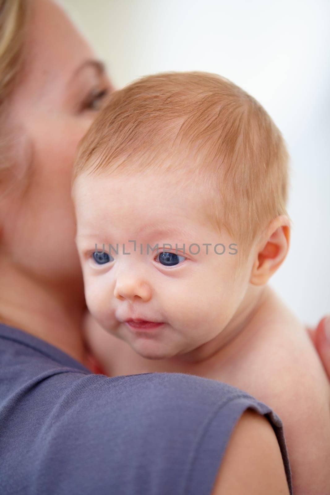 Family, shoulder and mom with baby in home for bonding, loving relationship and affection. Love, bedroom and closeup of mother carrying newborn for child development, growth and care in nursery.