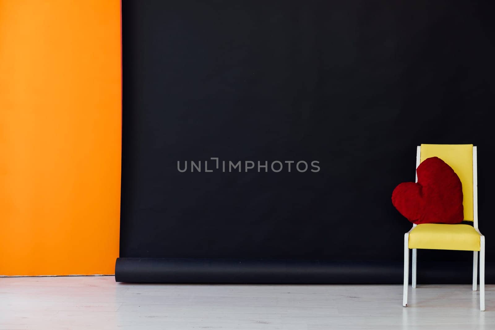 One chair in the interior of a black and orange room by Simakov