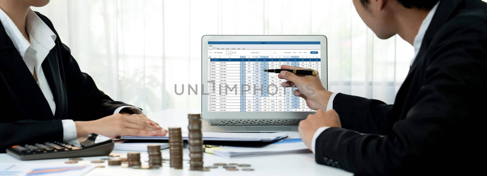 Corporate accountant use accounting software on laptop to calculate and maximize tax refunds and improve financial performance with business investment concept of growth stack coin in panorama. Shrewd