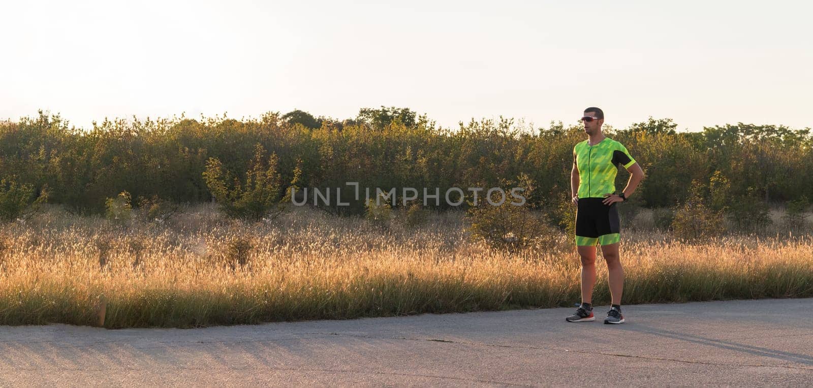 A triathlete resting after a hard morning's run. Training preparation for the upcoming marathon by dotshock