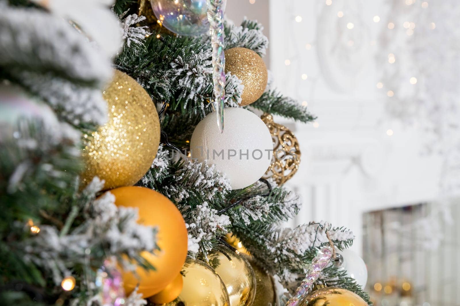 Christmas background. Christmas boarder with fir tree branch with cones and ornament. Christmas baubles in golden and red colour.