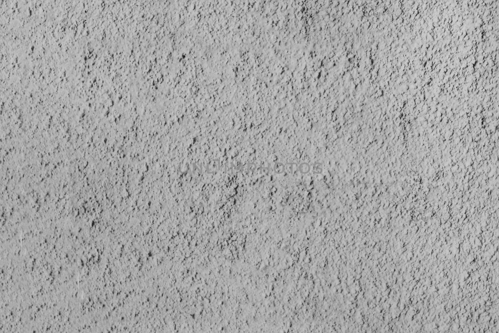 Rough texture of a gray concrete wall.