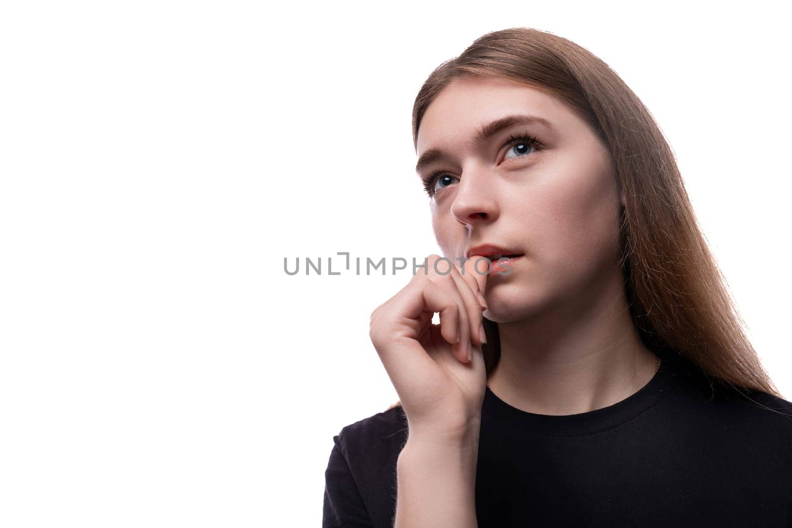 Portrait of a teenage girl in a black T-shirt on a white background.